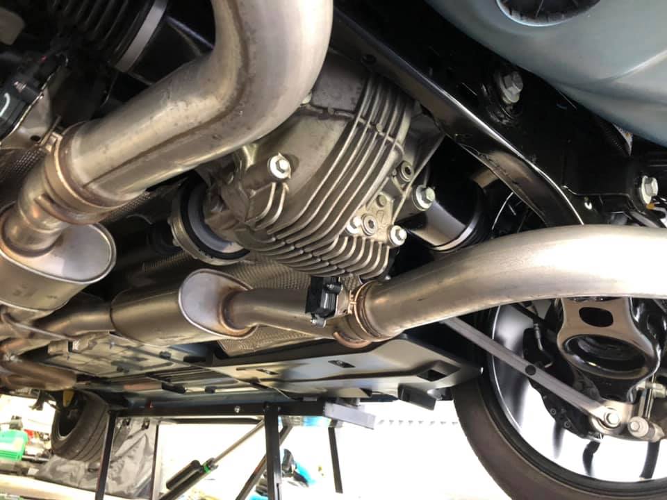 Close-up of the clean Challenger rear suspension and exhaust